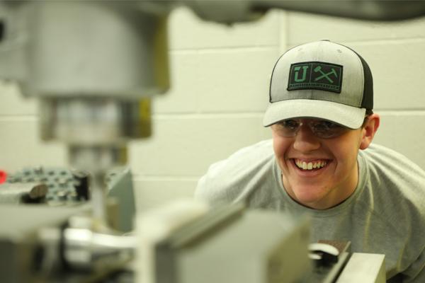 Student looking at lab equipment in action